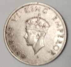 Moeda 1/2 rupia de 1946 da Índia – Britânica